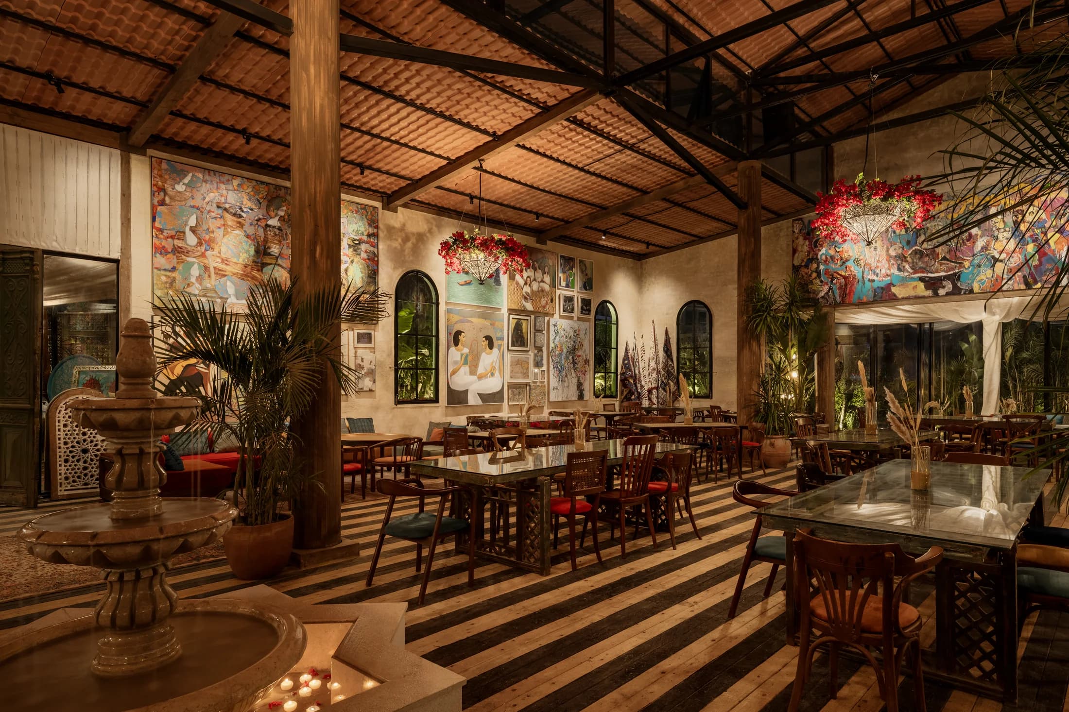 Babbo's dining room with timber columns, murals and striped flooring